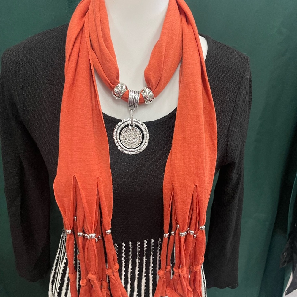 NEW orange scarf with decorative silver pendant